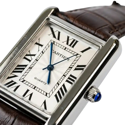 Cartier Tank watch with silver dial, blue hands, Roman numerals, and brown leather strap